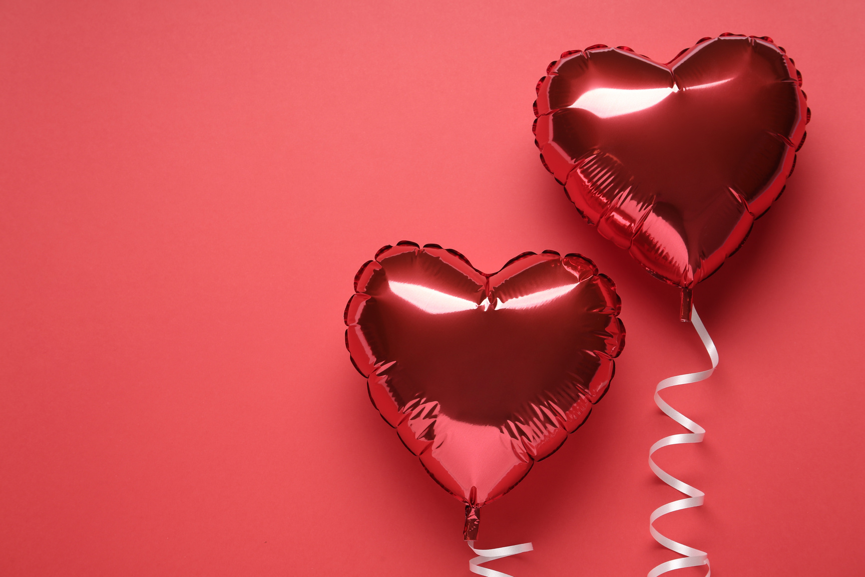 Heart Shaped Balloons on Red Background, Flat Lay with Space for Text. Valentine's Day Celebration